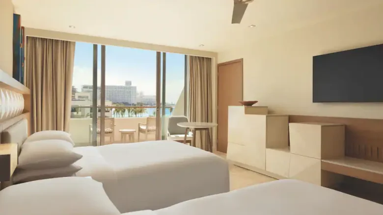 Ocean View Double room with two double beds, private balcony, and Caribbean Sea views at Hyatt Ziva Cancun.