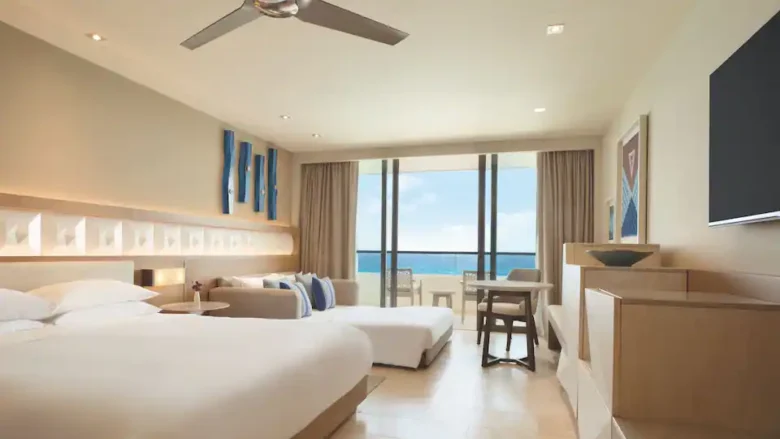 Oceanfront King room with sofa bed, private balcony, and panoramic sea views at Hyatt Ziva Cancun.