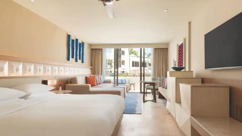 Resort View Master King room with sofa bed, spacious seating area, and private balcony overlooking the resort at Hyatt Ziva Cancun.