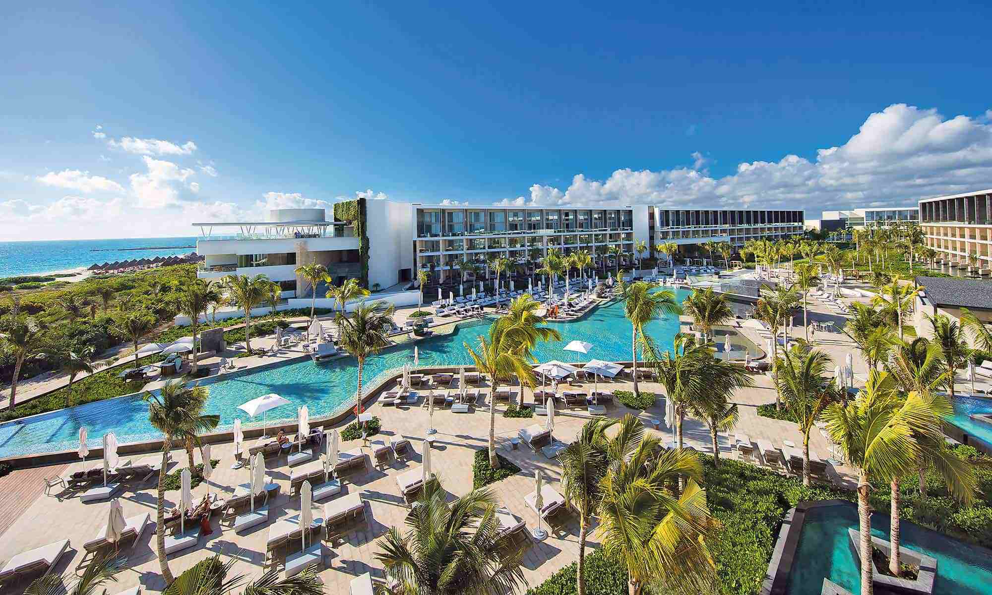 TRS Coral Hotel adults-only all-inclusive luxury resort in Costa Mujeres with infinity pool, modern suites, and beachfront relaxation.